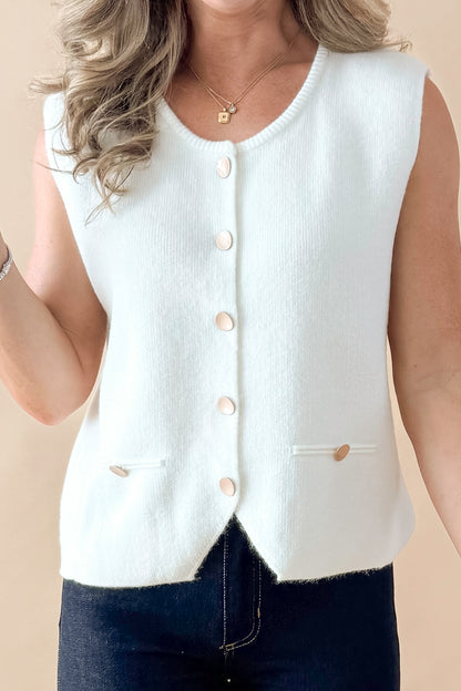 Front detailed view of woman wearing Cream Button Detail Sweater Vest with jeans against tan studio background.
