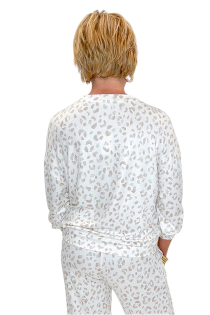 Back view of woman wearing Swagger Boutique’s Sandstone Soft Leo Long Sleeve Top with matching Joggers by Z Supply against white studio background.