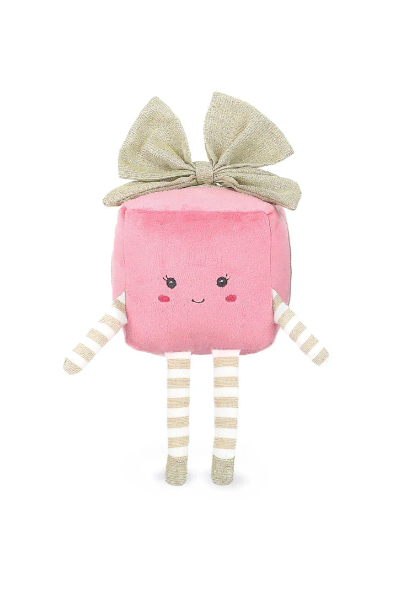 Pink plush toy with a bow on a white background