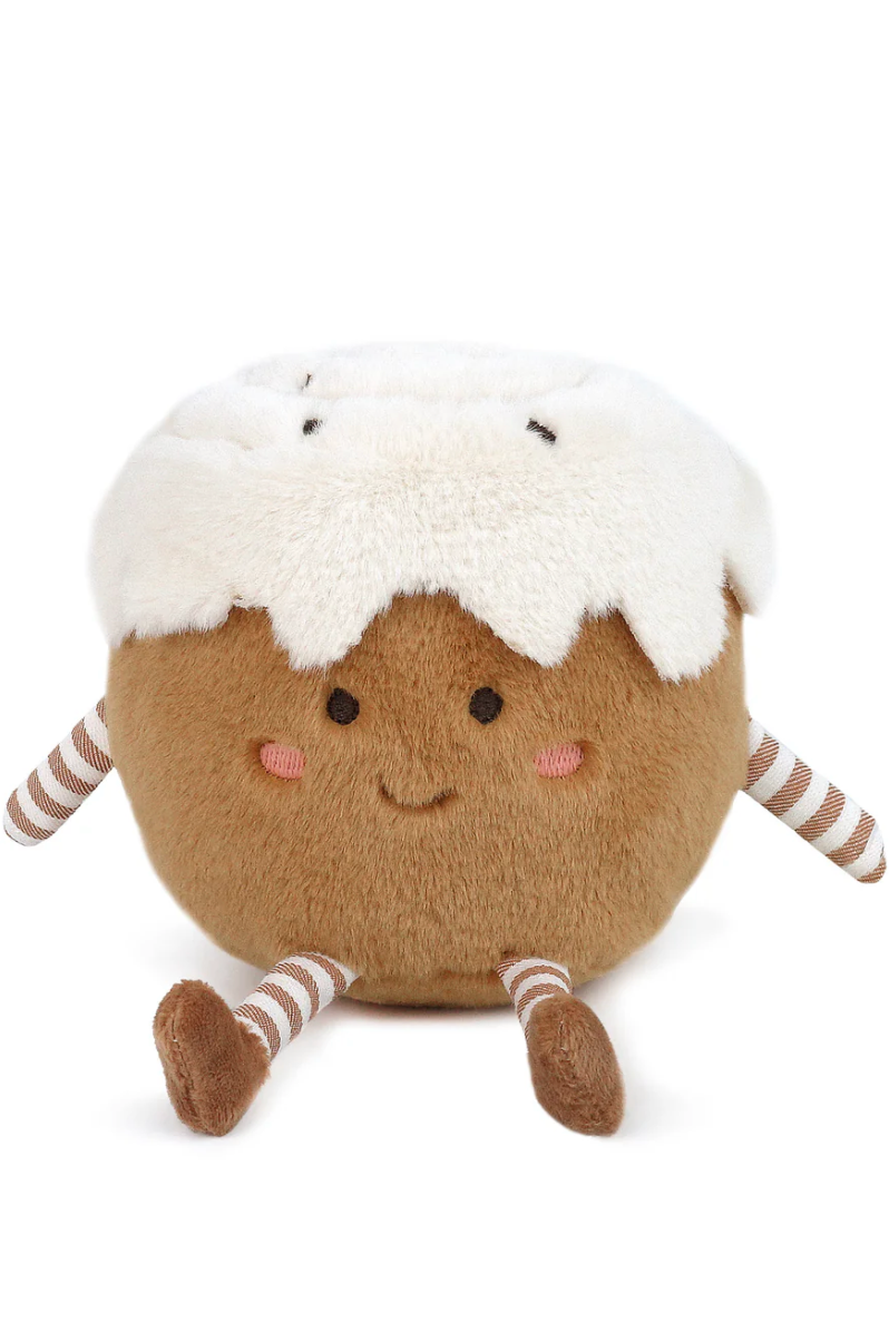 Toy resembling a cinnamon bun with a smiling face on a white background