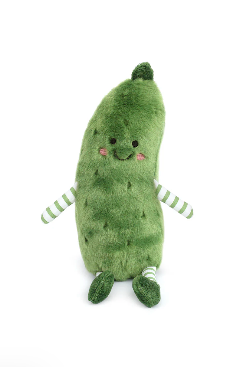 Plush toy pickle with a smiling face on a white background