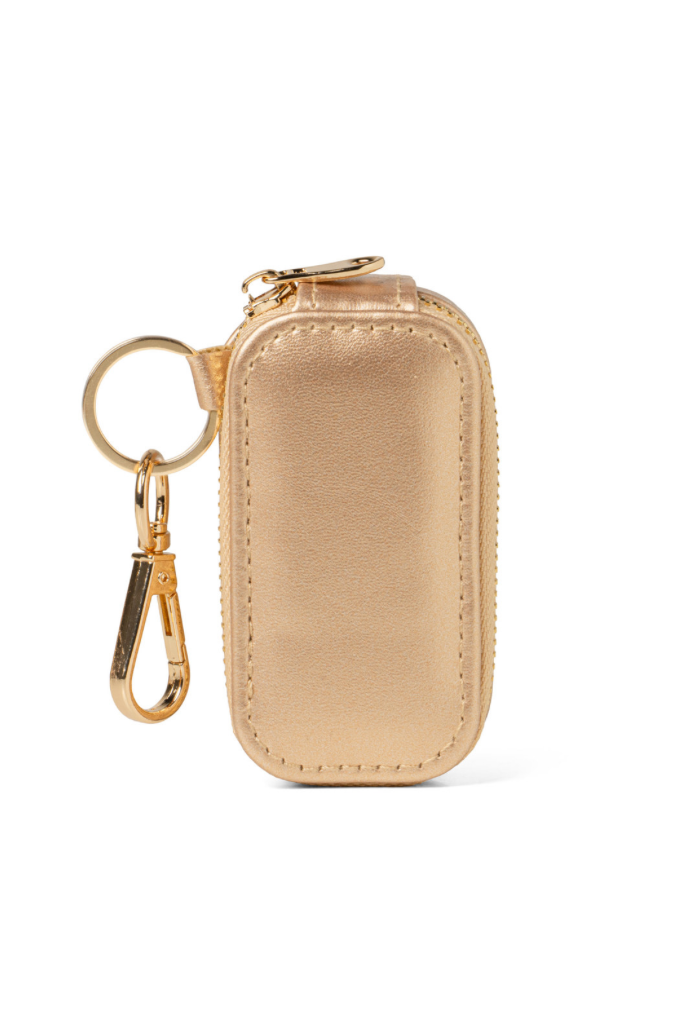 Beige keychain pouch with gold zipper and keyring on a white background