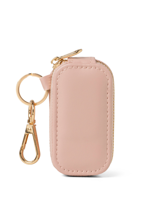 Pink keychain case with gold keyring on a white background
