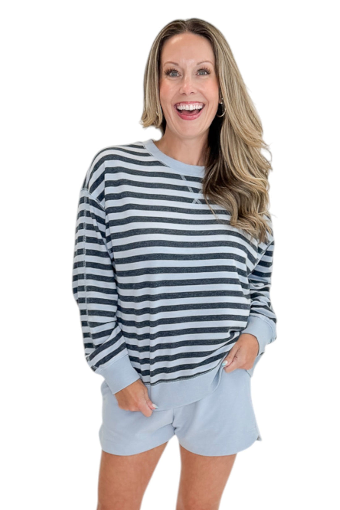 Front view of woman wearing Swagger Boutique’s Skyline The Everyday Short and Eclipse The Everyday Striped Crew by Z Supply against white studio background.