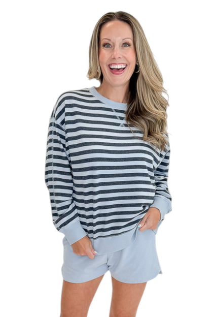 Front view of woman wearing Swagger Boutique’s Skyline The Everyday Short and Eclipse The Everyday Striped Crew by Z Supply against white studio background.