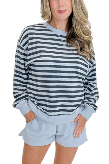 Front detail view of woman wearing Swagger Boutique’s Skyline The Everyday Short and Eclipse The Everyday Striped Crew by Z Supplyagainst white studio background.