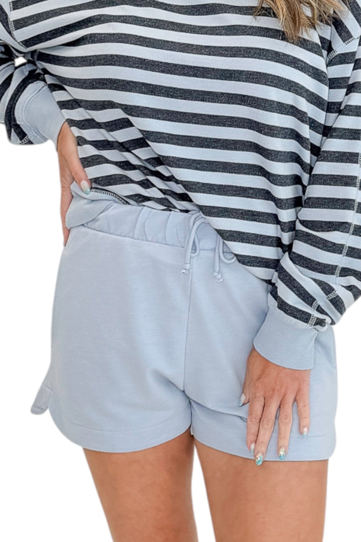 Front view of woman wearing Swagger Boutique’s Skyline The Everyday Short and Eclipse The Everyday Striped Crew by Z Supplyagainst white studio background.