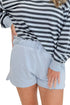 Front view of woman wearing Swagger Boutique’s Skyline The Everyday Short and Eclipse The Everyday Striped Crew by Z Supplyagainst white studio background.