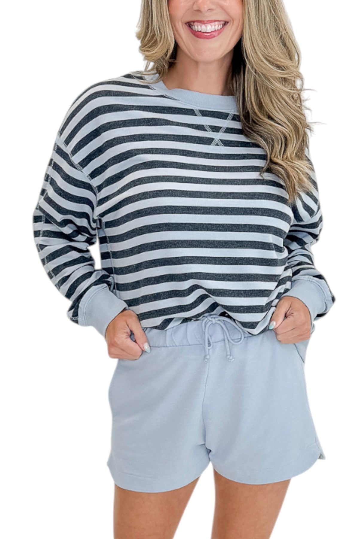 Front detail view of woman wearing Swagger Boutique’s Skyline The Everyday Short and Eclipse The Everyday Striped Crew by Z Supplyagainst white studio background.
