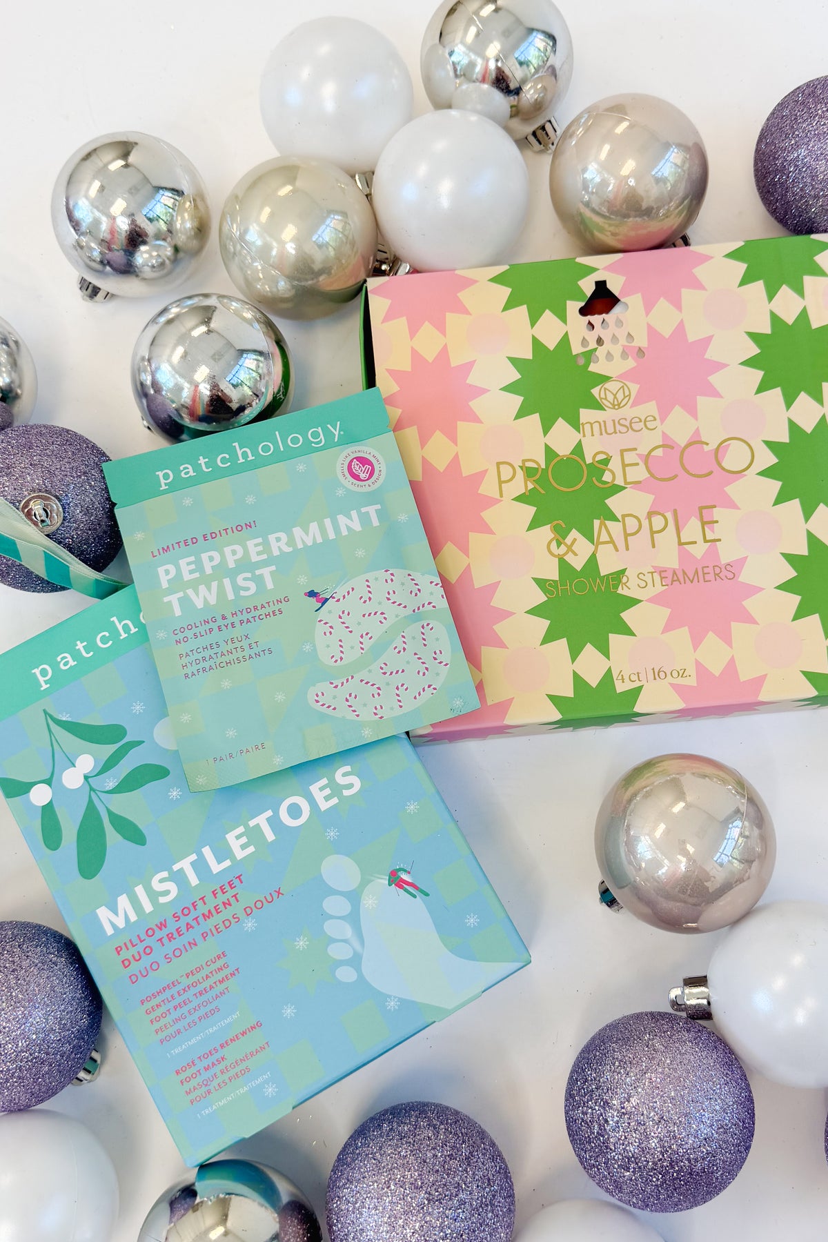 Peppermint Twist Eye Gels and other Spa Items against holiday studio background.