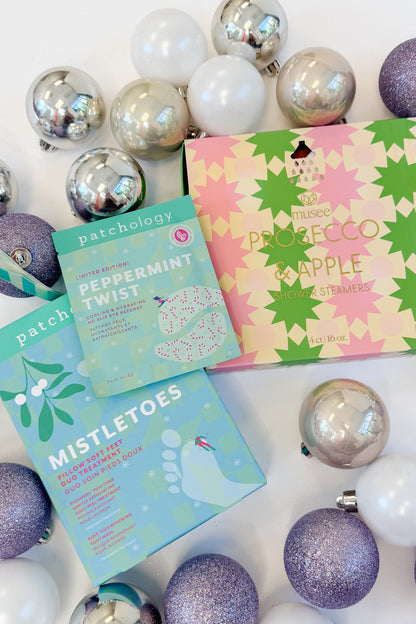 Peppermint Twist Eye Gels and other Spa Items against holiday studio background.