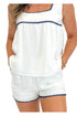 Front detail view of woman wearing Swagger Boutique’s White & Blue Square Neck Stitch Detail Tank with matching shorts against white studio background.