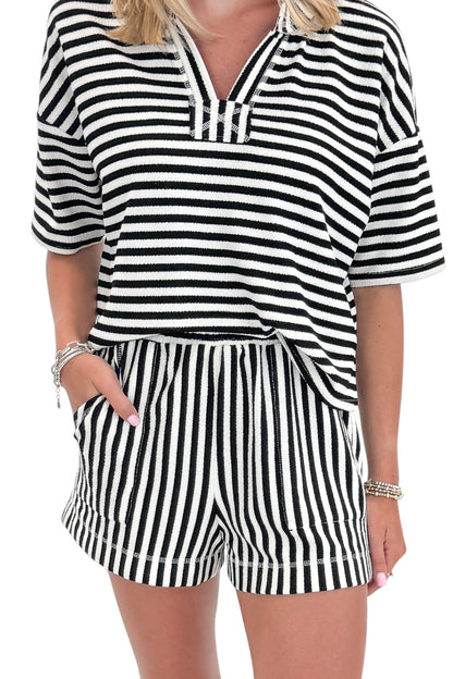 Front detail view of woman wearing Swagger Boutique’s Black &amp; White Striped Lounge Shorts with matching shorts against white studio background.