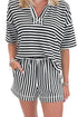 Front detail view of woman wearing Swagger Boutique’s Black & White Striped Lounge Shorts with matching shorts against white studio background.