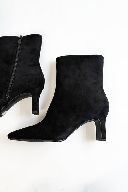 Swan- Black Suede Booties side view against white studio background.