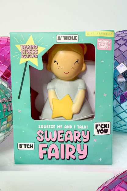 A boxed novelty stress-relief toy labeled "Sweary Fairy" by Gift Republic. The package shows a cartoon fairy figure with a yellow star and a wand, set in a mint box with bold pink and white text.
