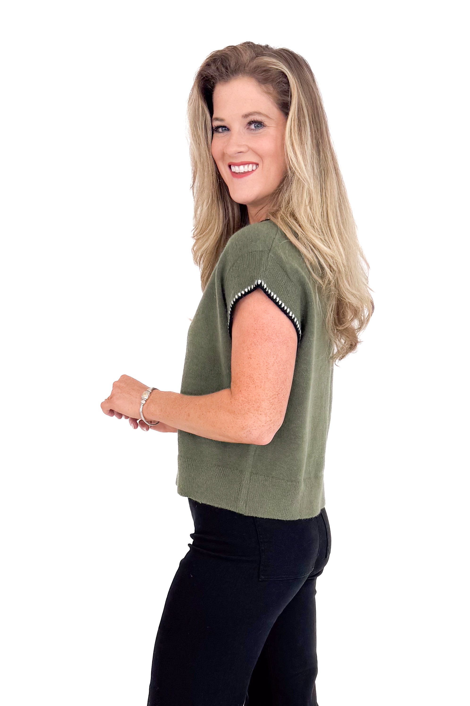 Woman wearing a green top with a white background
