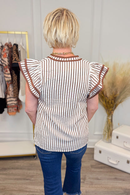 Woman wearing Rise &amp; Shine Brown Striped Flutter Sleeve Top by Entro - back view showing brown striped pattern and flutter sleeves