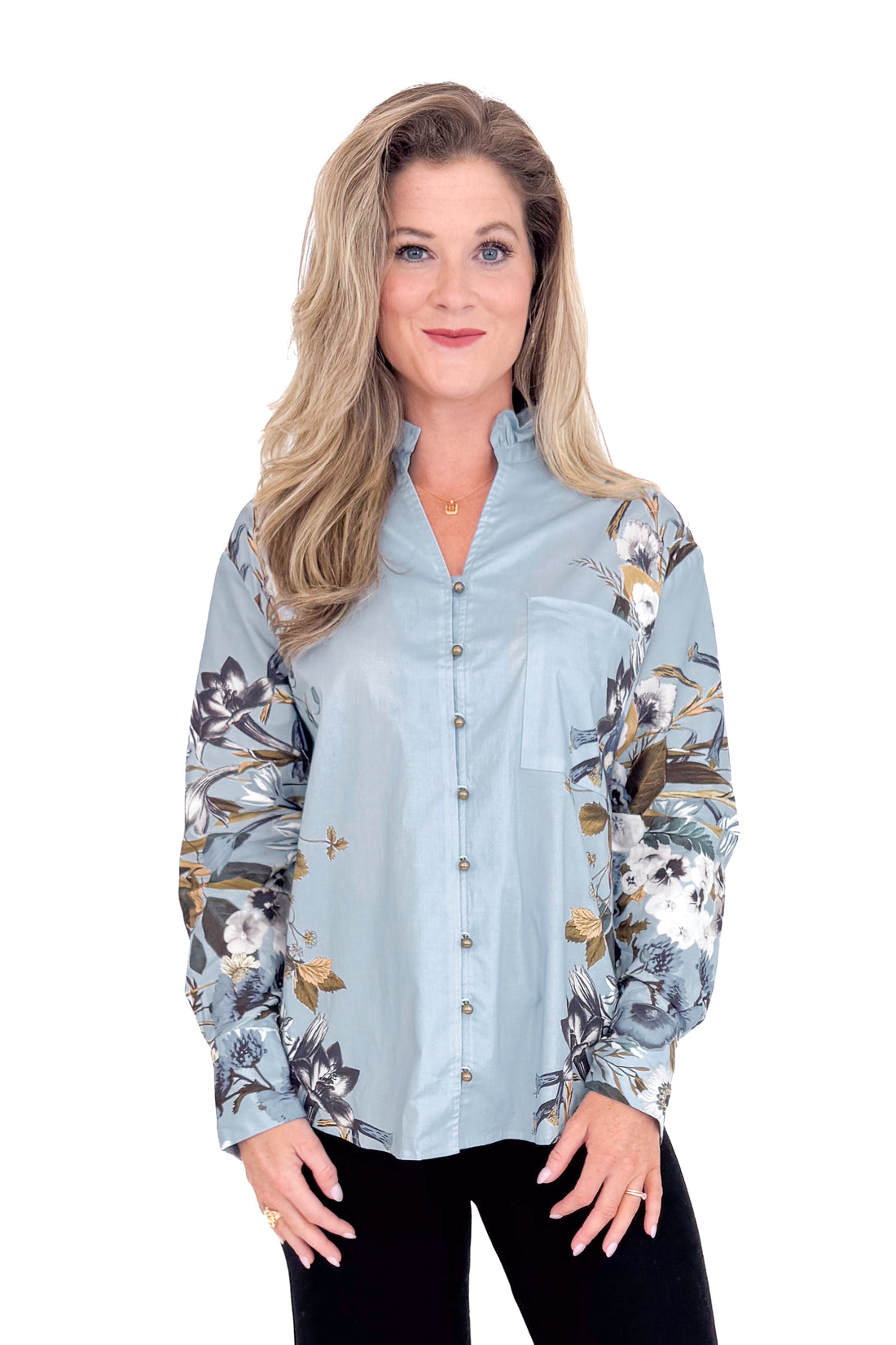 Woman wearing a floral-patterned shirt on a white background