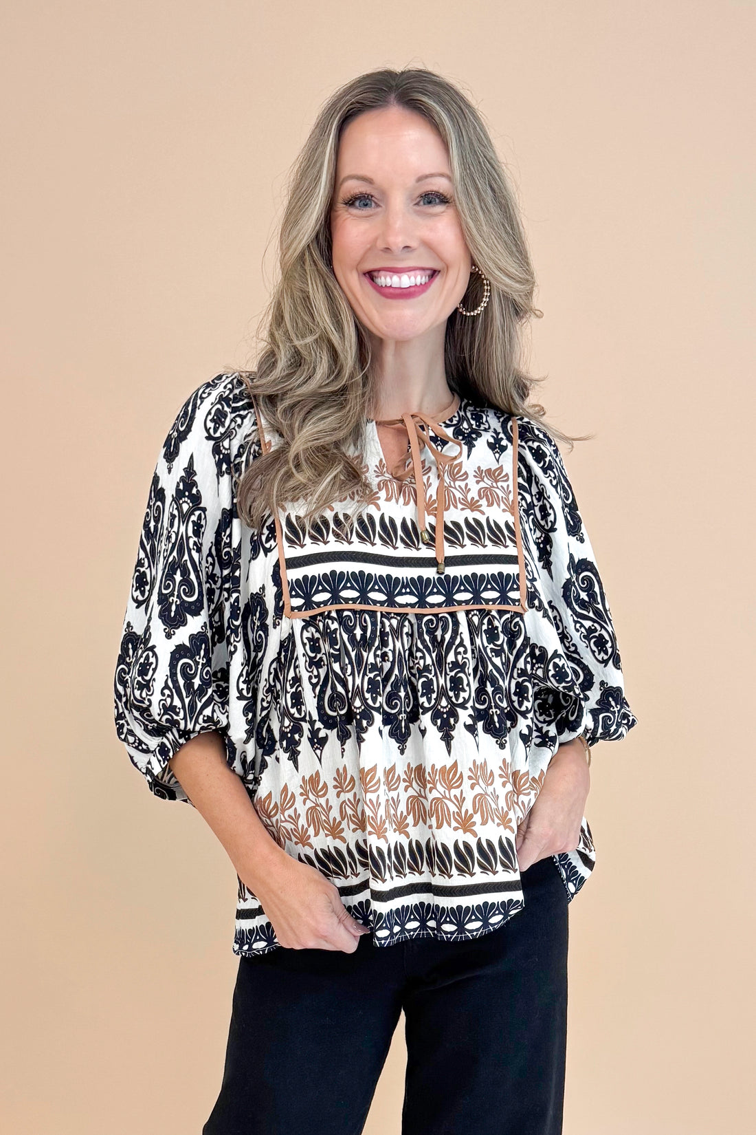 Woman wearing All The Fall Things Black &amp; Brown Printed 3/4 Sleeve Top by Entro - front view showing autumn-themed print and 3/4 sleeves