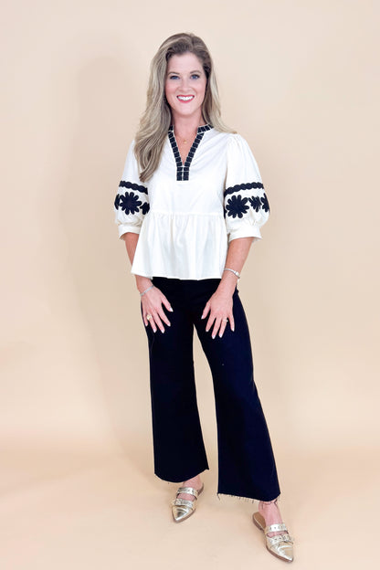 In Good Spirits Ecru With Black Embroidered Sleeve Peplum Top by Entro