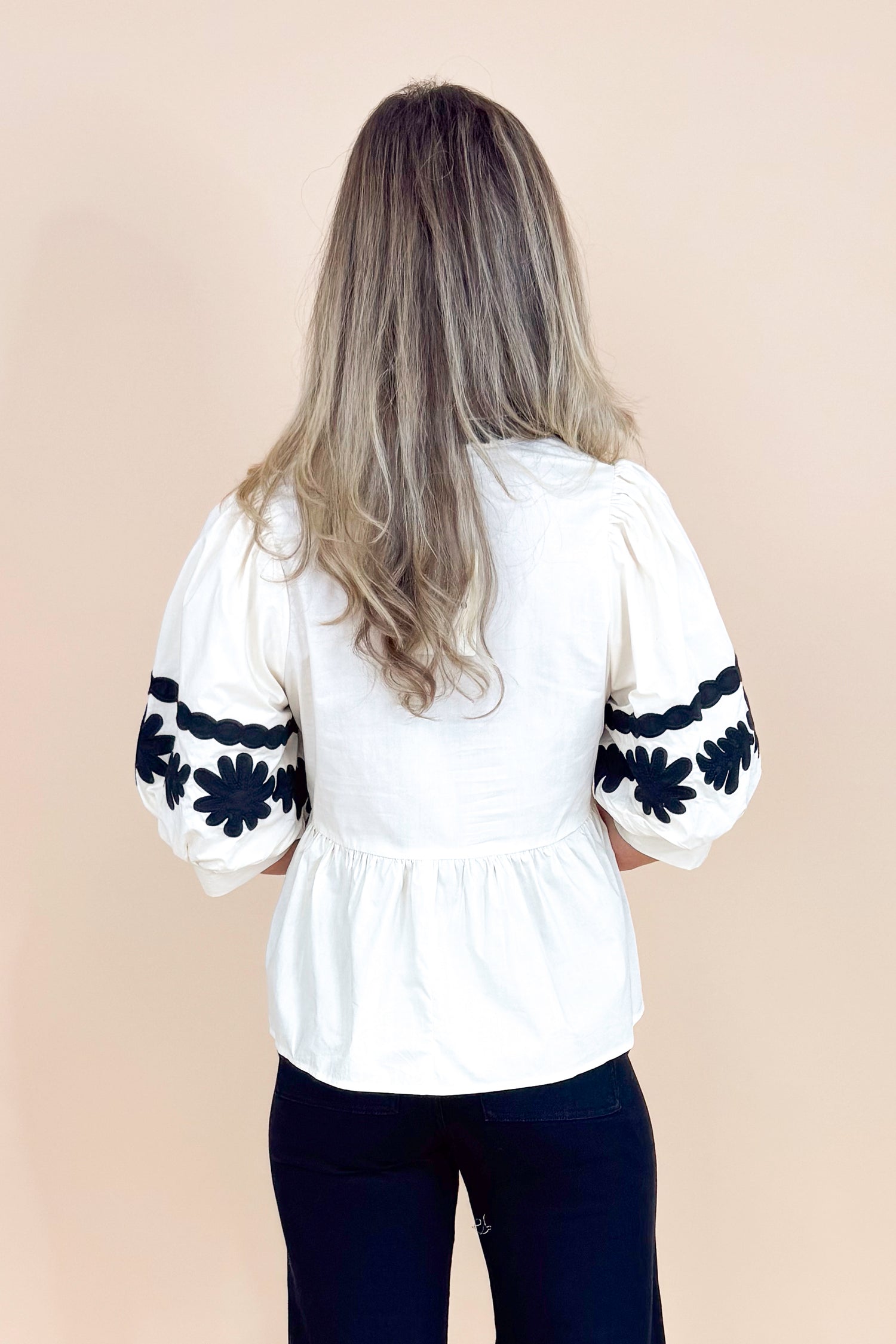 In Good Spirits Ecru With Black Embroidered Sleeve Peplum Top by Entro