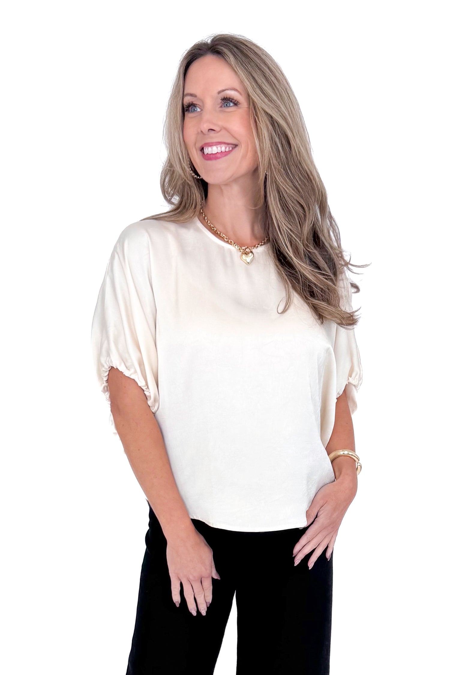 Front view of woman wearing Champagne Satin Tie Sleeve Top with jeans against white studio background.