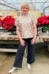 Front view of woman wearing Gold Leopard Print Top by Entro with jeans by holiday decor.