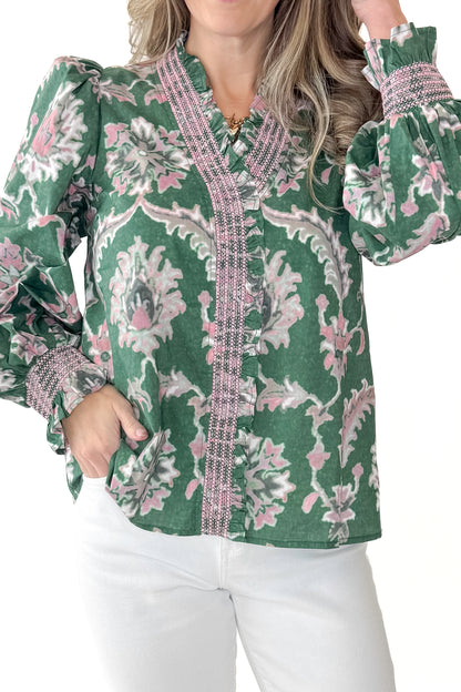 Front detail view of woman wearing Green &amp; Pink Printed Smocked Center Top with jeans against white studio background.