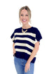 Front view of woman wearing Navy & Cream Sleeveless Sweater by Entro with jeans against white studio background.