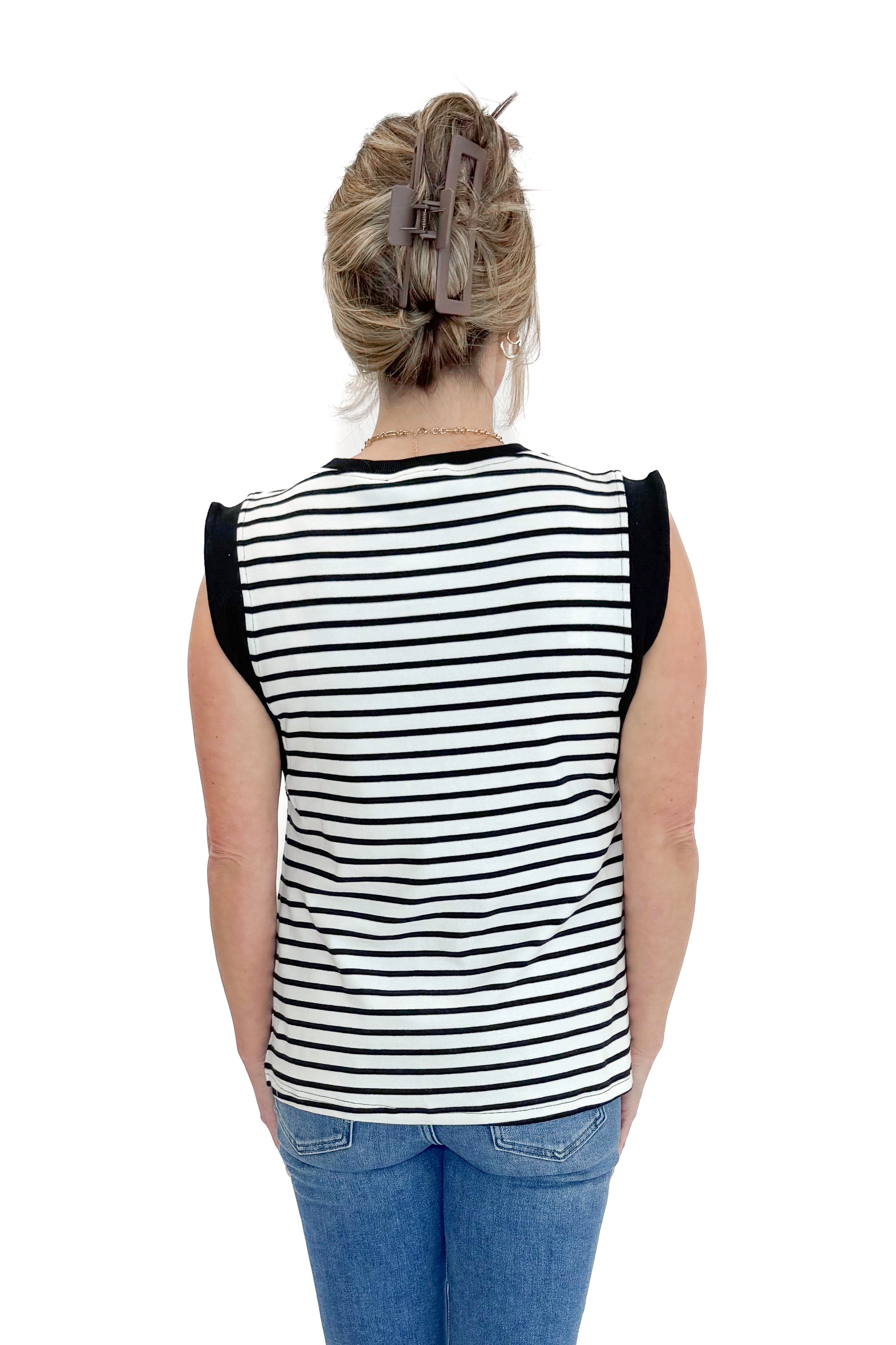 Back view of woman wearing White &amp; Black Striped Sleeveless Top by Entro with jeans against white studio background.