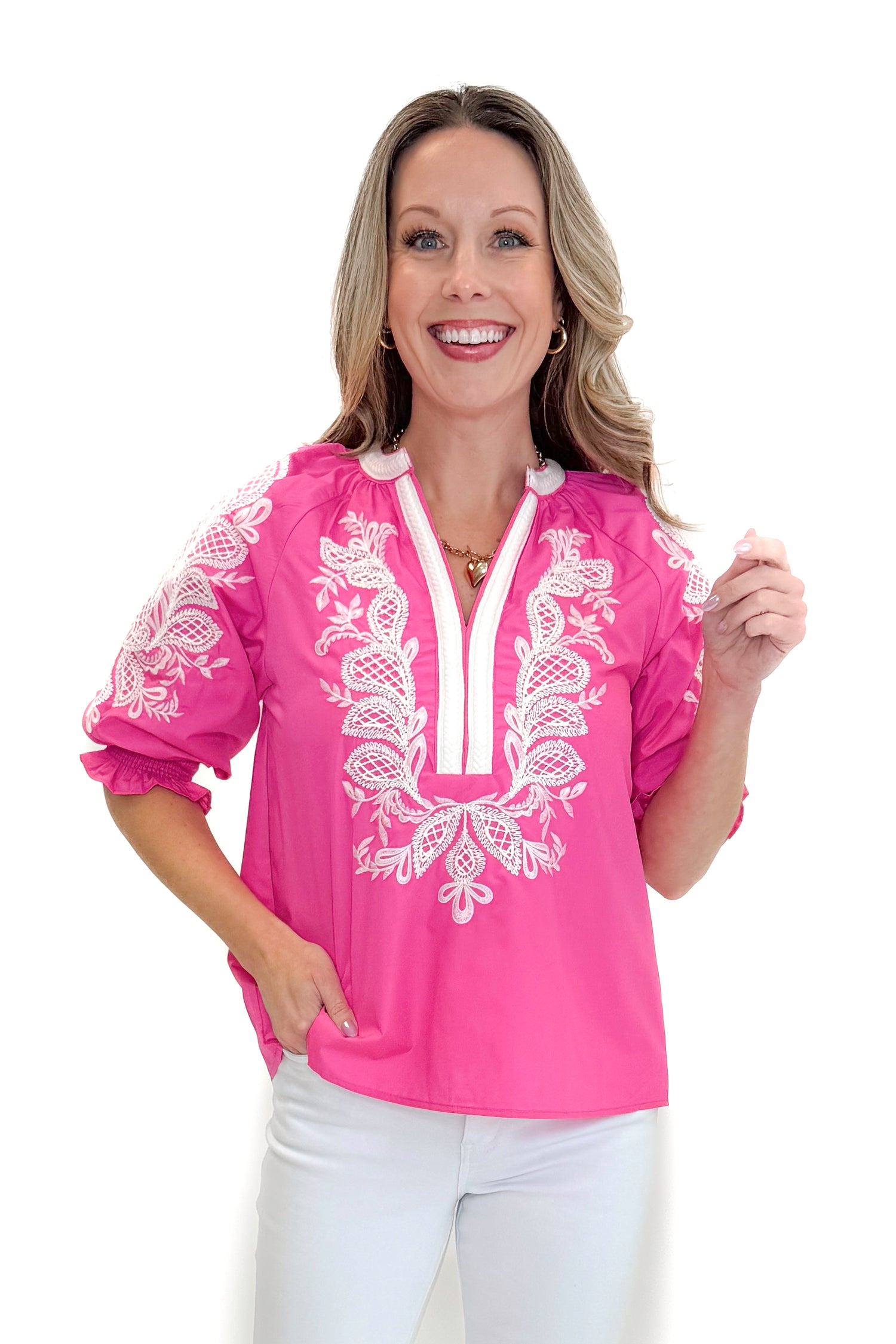 Front view of woman wearing Pink &amp; White Embroidered 3/4 Sleeve Top by Entro with jeans against white studio background.