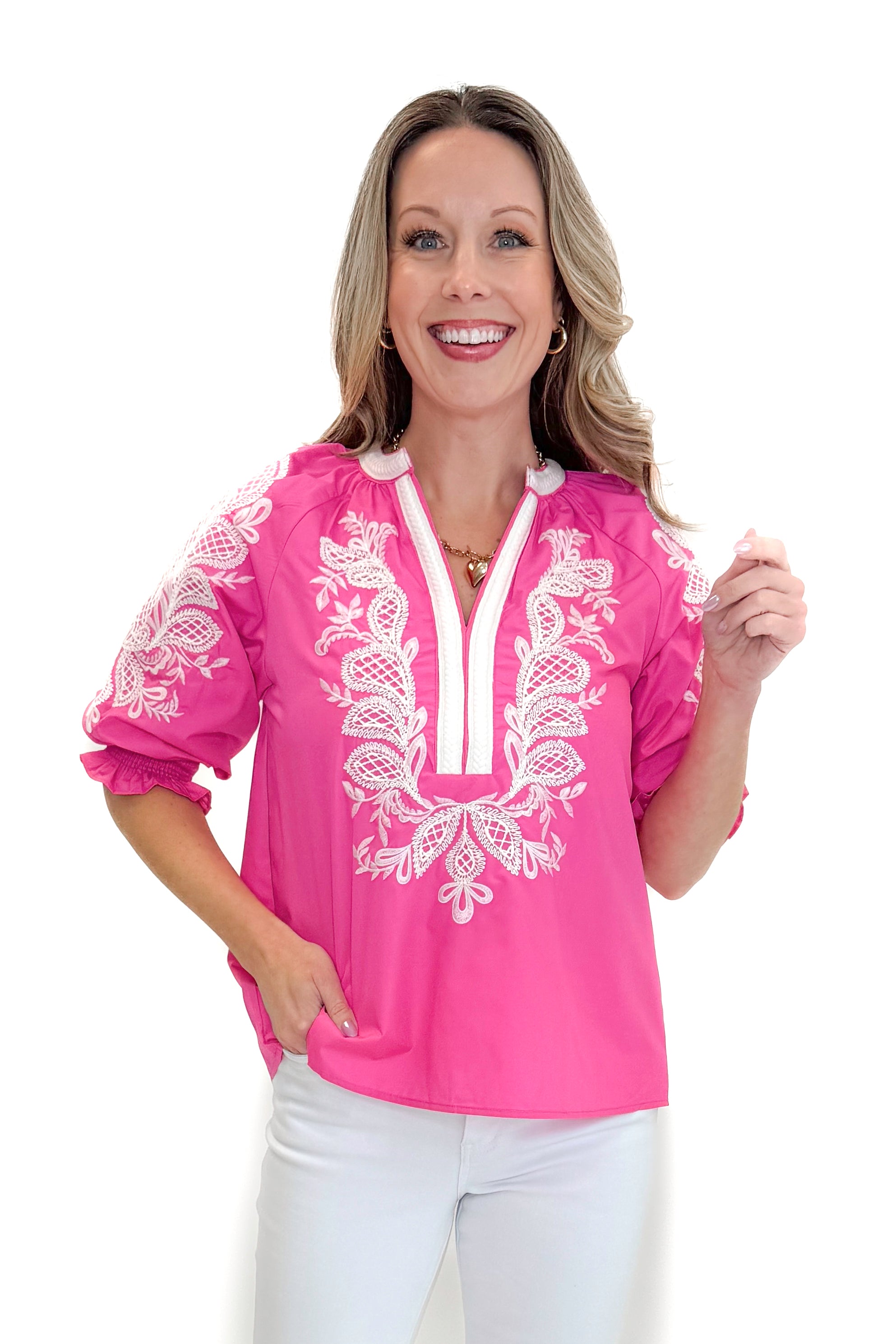 Front view of woman wearing Pink &amp; White Embroidered 3/4 Sleeve Top by Entro with jeans against white studio background.