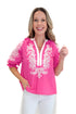 Front view of woman wearing Pink & White Embroidered 3/4 Sleeve Top by Entro with jeans against white studio background.