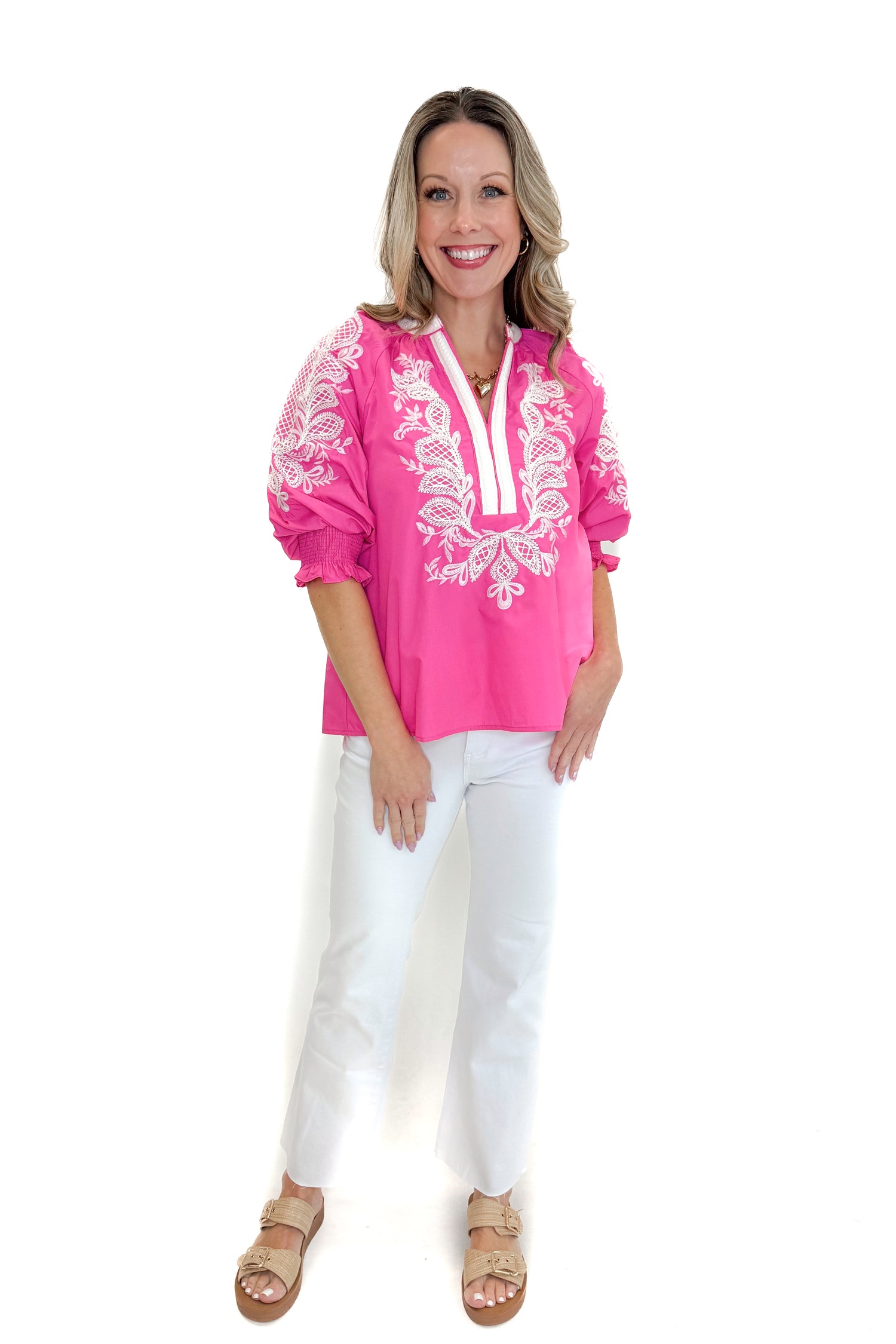 Front view of woman wearing Pink &amp; White Embroidered 3/4 Sleeve Top by Entro with jeans against white studio background.