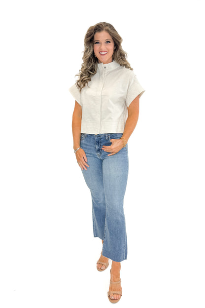 Front view of woman wearing Linen Stitch Detail Collared Top by Entro with jeans against white studio background.
