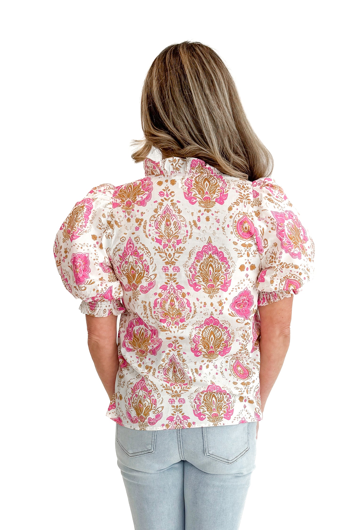 Back view of woman wearing Pink &amp; Tan Paisley Printed Top by Entro with jeans against white studio background.
