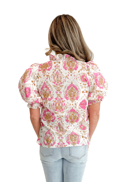 Back view of woman wearing Pink &amp; Tan Paisley Printed Top by Entro with jeans against white studio background.