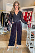 Front view of woman wearing Navy Velvet Leopard Print Pants with bodysuit at a boutique