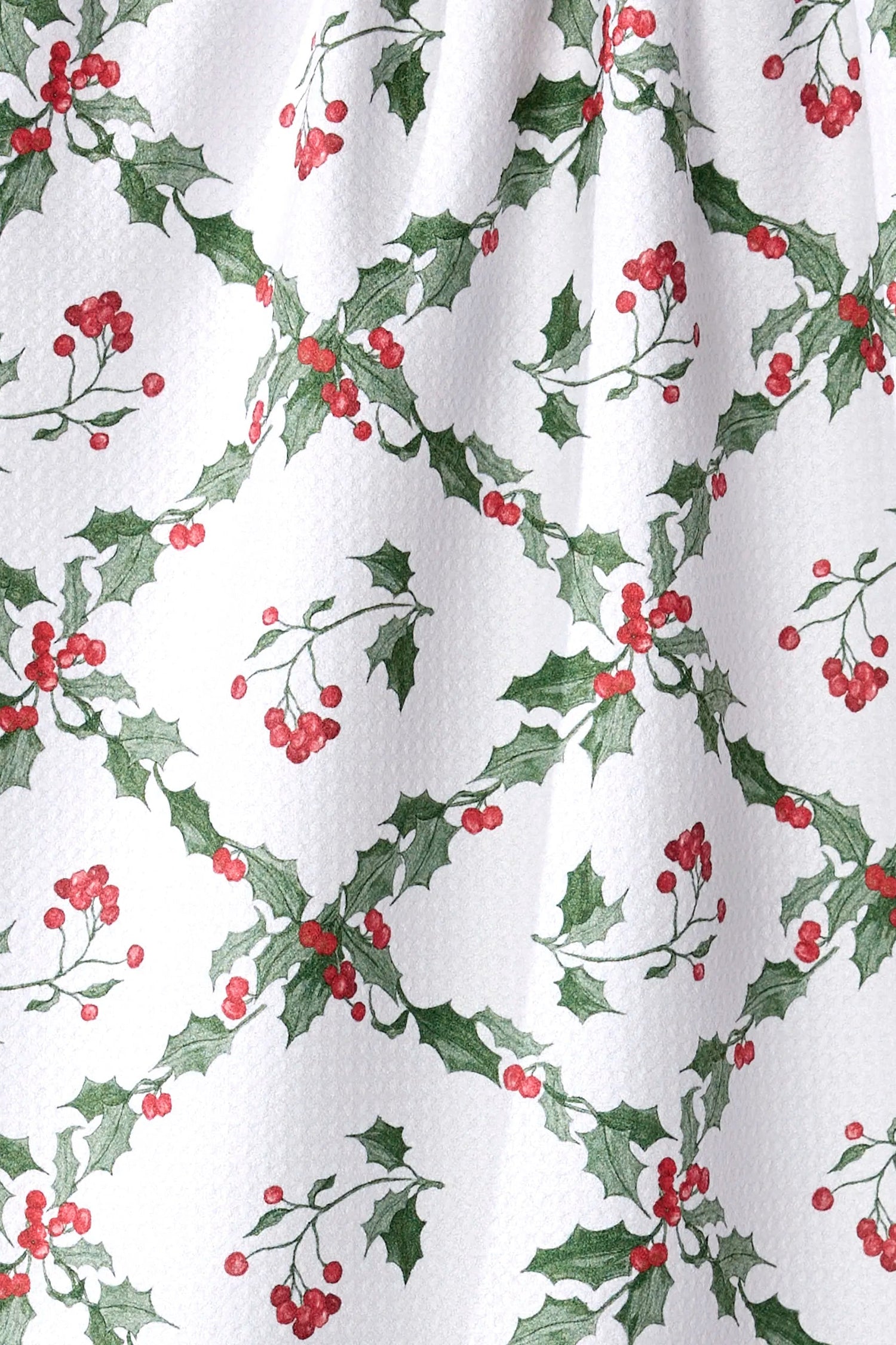 Curtain with holly leaf and berry pattern on a white background