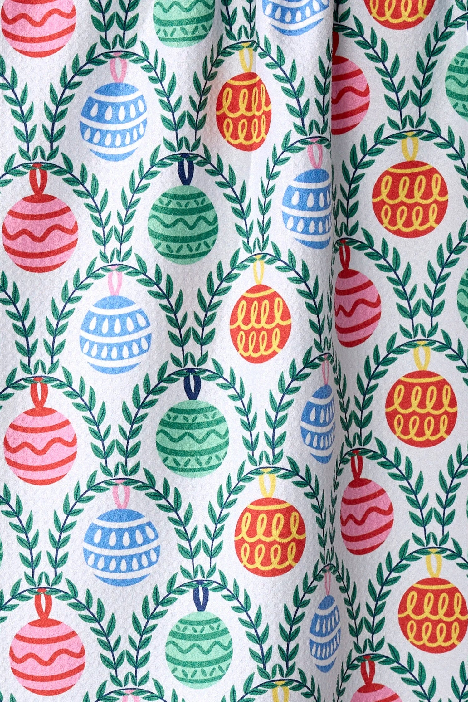 Fabric with colorful Christmas ornament pattern on a white background