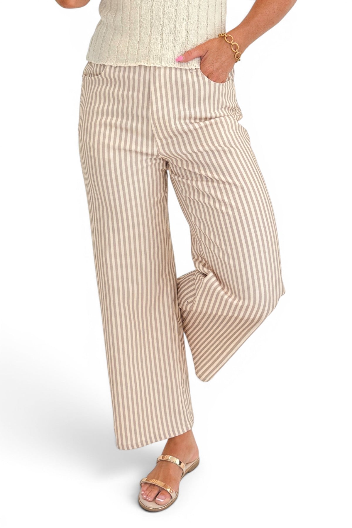 Front view of woman wearing Swagger Boutique’s Tan &amp; Beige Striped Jeans by Entro with sweater against white studio background.