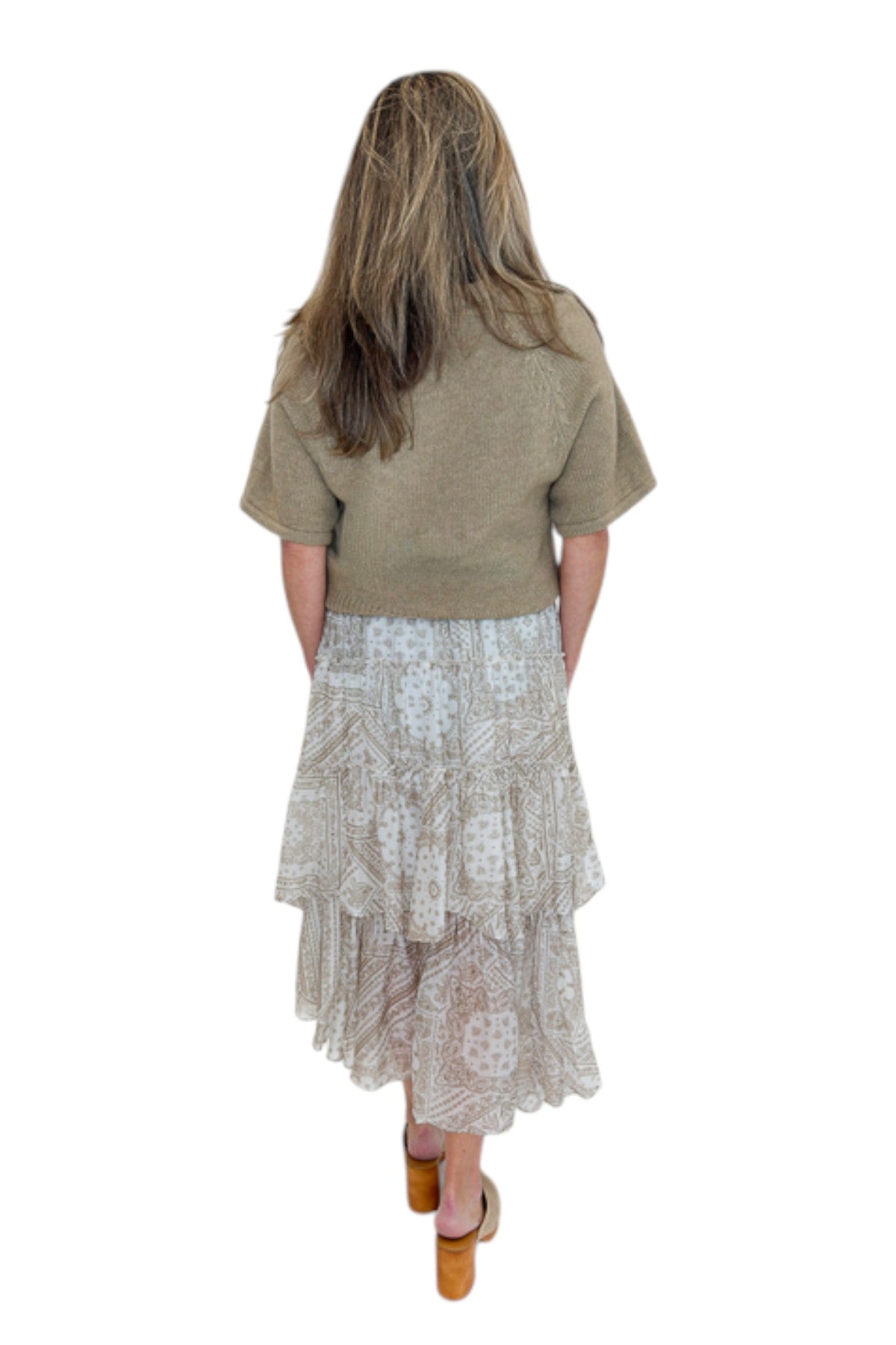 Back view of woman wearing Swagger Boutique’s Taupe Bandana Print Tiered Skirt with Oatmeal Braid Detail Short Sleeve Sweater by Entro against white studio background.