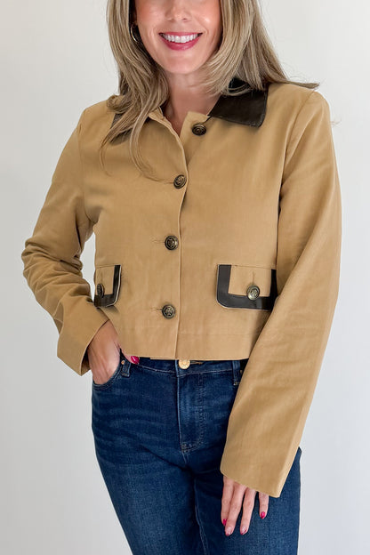 Front detail view of woman wearing Swagger Boutique’s Taupe Button Up Leather Collared Jacket with jeans against white studio background.