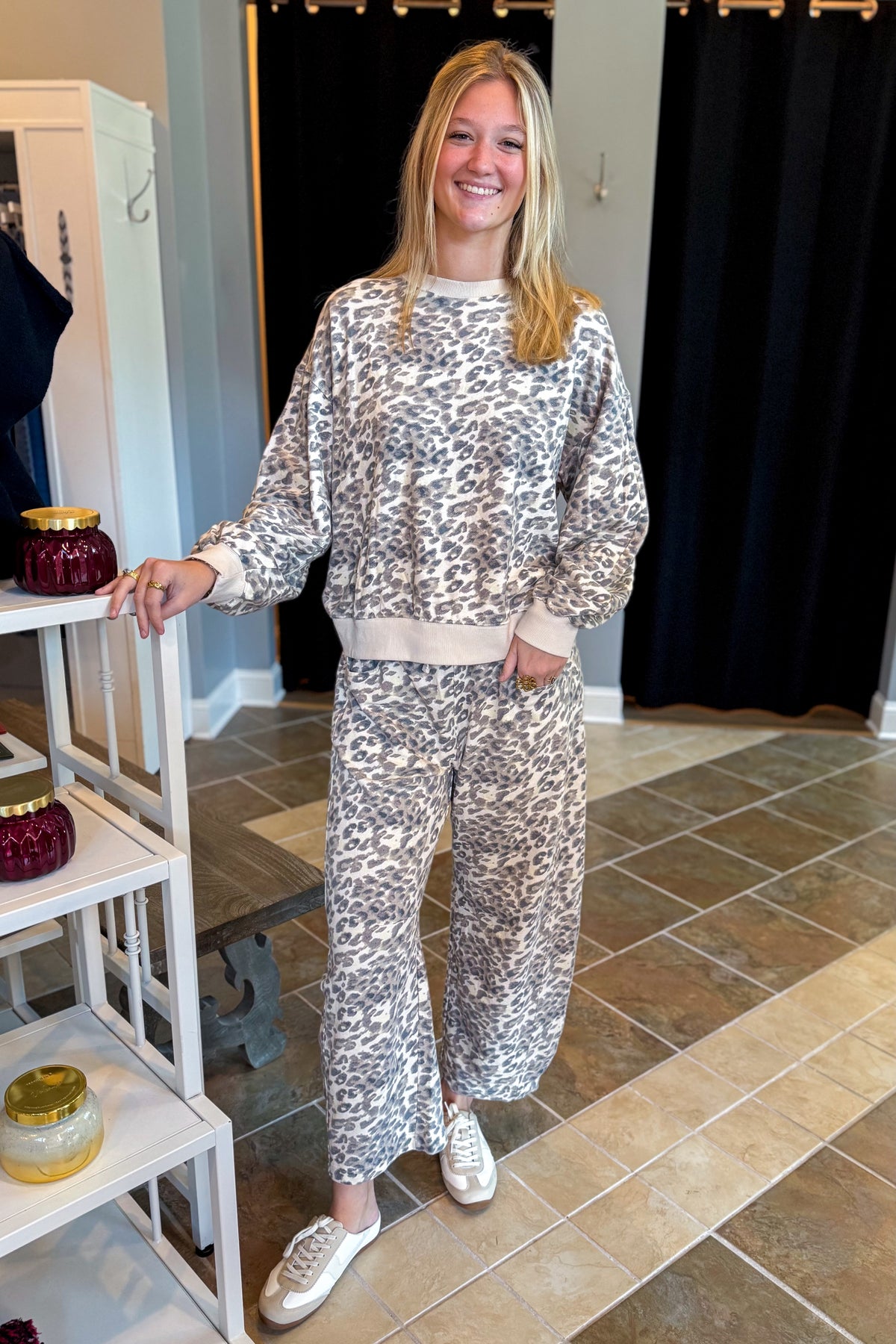 Front view of woman wearing Swagger Boutique’s Taupe Leopard Sweatpants and Sweatshirt standing at the store.