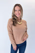 Front view of woman wearing Swagger Boutique’s Taupe Ribbed Hem Sweater with jeans against white studio background.
