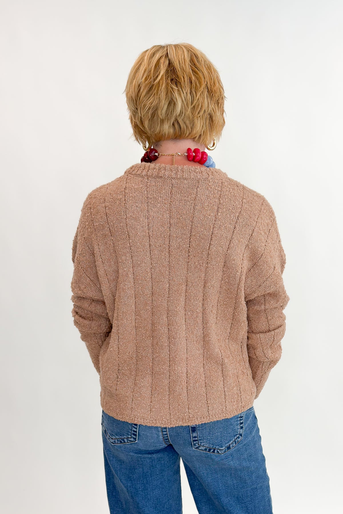 Back view of woman wearing Swagger Boutique’s Taupe Ribbed Textured Sweater with Maya Wide Leg Jeans In Medium Wash- Journey by Kut from the Kloth against white studio background.
