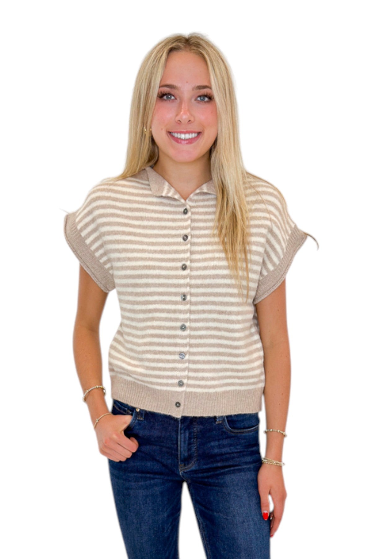 Front view of woman wearing Swagger Boutique’s Taupe &amp; Cream Striped Sleeveless Sweater by Entro with jeans against white studio background.