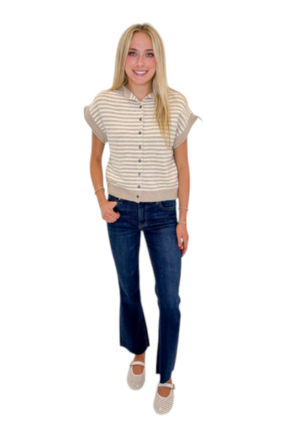 Front view of woman wearing Swagger Boutique’s Taupe &amp; Cream Striped Sleeveless Sweater by Entro with jeans against white studio background.