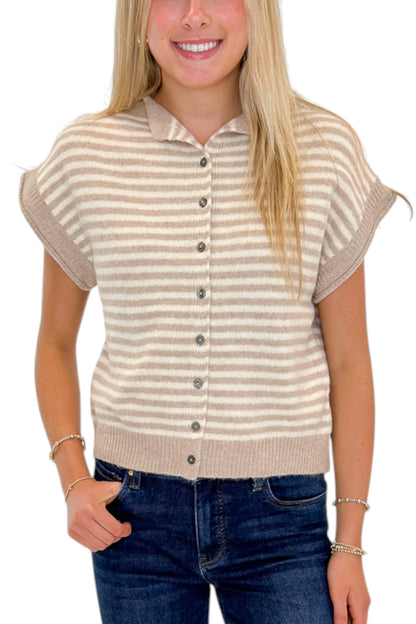Front detail view of woman wearing Swagger Boutique’s Taupe &amp; Cream Striped Sleeveless Sweater by Entro with jeans against white studio background.